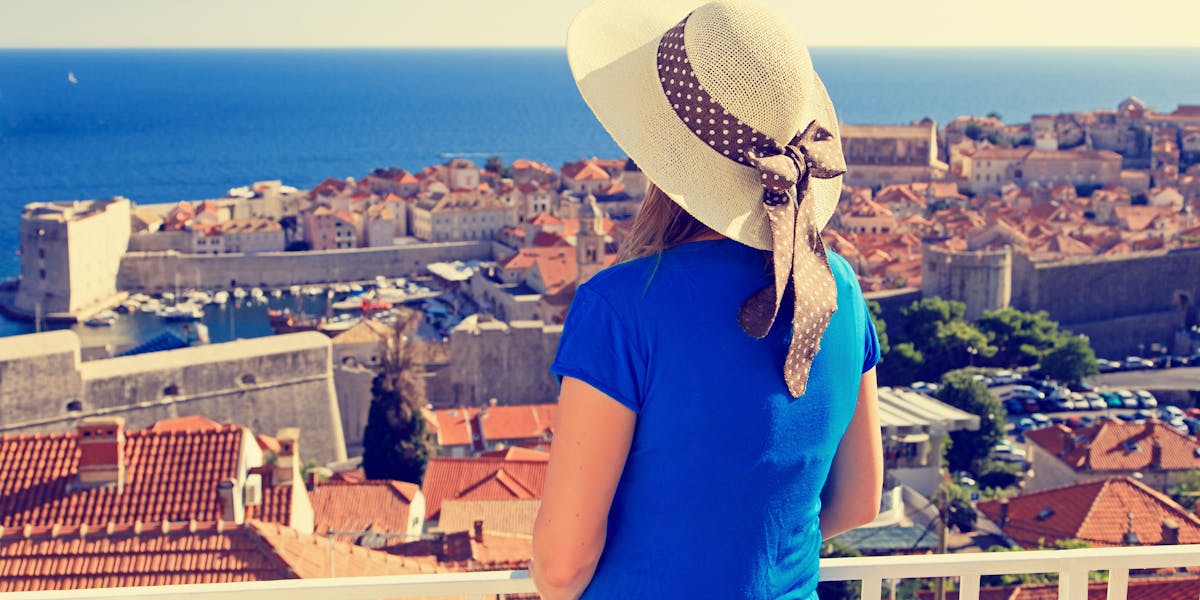 young woman looking at dubrovnik old town.jpg